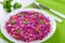 Salad coleslaw - red cabbage with carrots on white dish