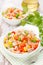 salad with corn, green peas, rice, red pepper and tuna, close-up