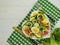 Salad cucumber plate heart on a white wooden background