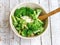 Salad in a deep bowl, broccoli, pepper and apple