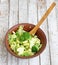 Salad in a deep bowl, broccoli, pepper and apple