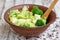 Salad in a deep bowl, broccoli, pepper and apple