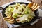 salad of fresh Brussels sprouts with nuts, cheese and fruits close-up. horizontal