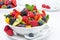 Salad of fresh fruit and berries in a bowl