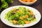 Salad with fried shrimps. Wooden background. Top view. Close-up