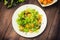 Salad with fried shrimps. Wooden background. Top view. Close-up