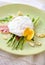 Salad with green asparagus with poached egg