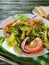 Salad green beans, tomato,delicious on a wooden gourmet background, bread red pepper appetizing