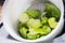 salad green lies in the colander for washing