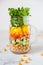 Salad in a jar. Homemade healthy salad from chickpea, tomato, ye