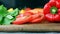 Salad leaves, cutted tomato, bell pepper and carrot on wooden board, making healthy vegetable salad, dolly shot