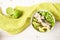 Salad from lettuce, crabs in cream and avocado in a bowl, green