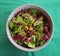 Salad with lettuce, kiwi, olives and radish