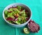 Salad with lettuce, kiwi, olives and radish