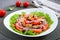 Salad of marinated mussels, fresh tomatoes, red onions, olives in a bowl