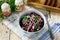 Salad with meat liver pork, beetroot and fresh cucumber on the kitchen wooden table