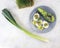 Salad of microgreens, avocado, boiled eggs, leek and arugula, on a plate, top view