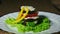 salad mother-in-law\'s tongue, a dish of eggplant, pepper, with mayonnaise, presentation, play with light