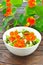 Salad nasturtium flowers dark table