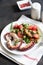 salad with octopus, tomatoes, olives and arugula. fresh healthy salad