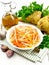 Salad of parsnip and carrot on white board