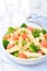 Salad with pasta, smoked salmon, broccoli and green peas