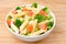 Salad with pasta, smoked salmon, and vegetables