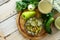 Salad with pickles and vegetables on the kitchen wooden background. Homemade pickle. Top view flat lay background