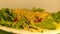 Salad plate green tomatoes cheese organic pouring oil dish drops fly