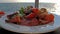 Salad plate on a table whith the ocean in background while the cruise vessel is driving