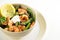 Salad from prawn shrimp, green asparagus and lemon slice in a bo