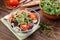 Salad with red cabbage, radish sprouts, corn and tomatoes