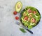 Salad with salmon, avocado eating nutrition on gray concrete background