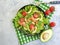 Salad with salmon, avocado nutrition on gray concrete background