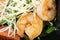 Salad with shrimp, arugula, green onions and tomatoes.