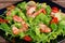 Salad with shrimp, arugula and tomato