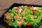 Salad with shrimp, arugula and tomato