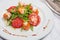 Salad with shrimps, tomatoes and arugula