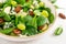 Salad of spinach, pear, grape, pecan and gorgonzola cheese with lemon dressing.