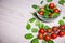 Salad with spinach and tomatoes and copy space on wooden table