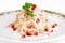 Salad with squid, onion, apple and pomegranate