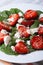 Salad with strawberries, spinach, goat cheese and sesame