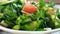 Salad tomato cucumber greens , pour oil slow-motion