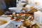 Salad with tomato, mozzarela, basilica on wooden board on kitchen table, blur concept, spanish or italian breakfast with cheese