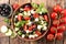 Salad with tomato, olive, feta cheese, basil and sauce