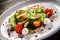 Salad with tomatoes, cucumbers, pepper and mozzarella