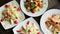 Salad top view. Plates on table. Food photography concept. Healthy diet. Banner size