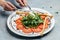 Salad with traditional italian burrata cheese with arugula, tomatoes and green pesto, Food recipe background. Close up