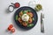 Salad with traditional italian burrata cheese made from cream and milk of buffalo or cow with pesto and tomatoes and seasonings on