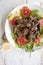 Salad with turkey liver, mushrooms and red oranges